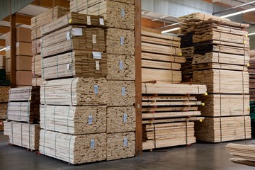 Stacks of plywood piled up in warehouse