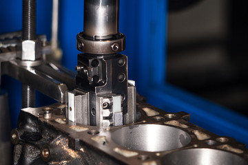 Car engine repair at the factory and parts after disassembly.