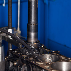Car engine repair at the factory and parts after disassembly.