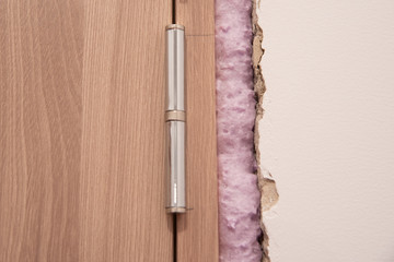 Installation of doors using polyurethane foam mounting