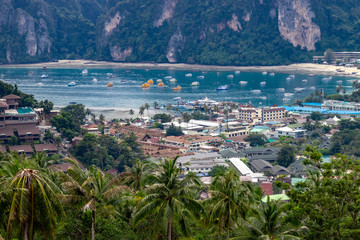 Fototapeta na wymiar Speedboats and traditionals boats sailing in Andaman Sea as seen from viewpoint in Phi Phi Islands in Thailand.