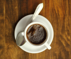 Coffee Cup on a wooden plank table
