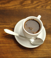 Coffee Cup on a wooden plank table