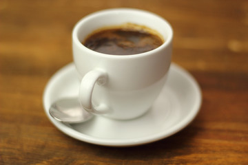 Coffee Cup on a wooden plank table