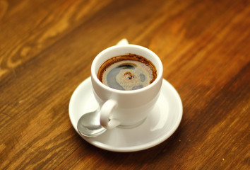 Coffee Cup on a wooden plank table