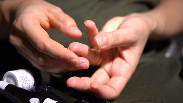 Measuring Glucose Level Blood Test. Diabetes Person. Close Up