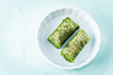 Multicolored baklava, Oriental sweetness on a plate