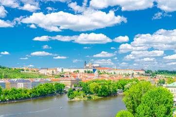 Fototapeta na wymiar Aerial panoramic view of Prague city, historical center with Prague Castle, St. Vitus Cathedral in Hradcany district, Strelecky island, Vltava river, blue sky white clouds, Bohemia, Czech Republic