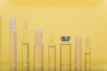 Glass medical ampoule vial for injection. Medicine is liquid sodium chloride with of aqueous...