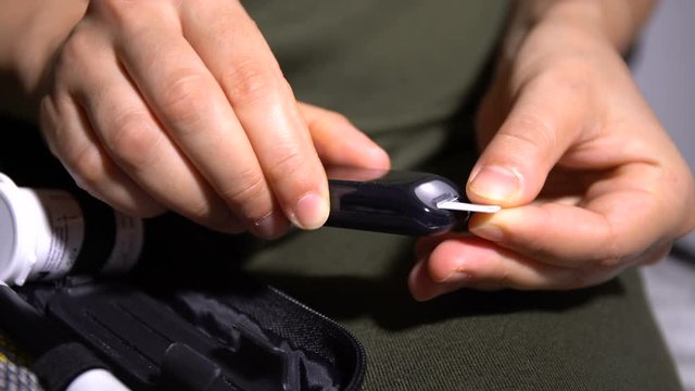 Girl Diabetic Measures Blood Glucose. Preparing Glucomete And Strips