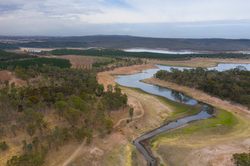 Fototapeta na wymiar Aerial view of a fresh water reservoir in rural Australia which is reducing due to the extreme drought