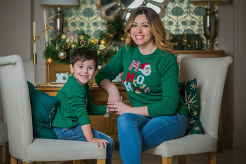 Happy family scene, little kid and mom celebrate Christmas, relationship parents and children