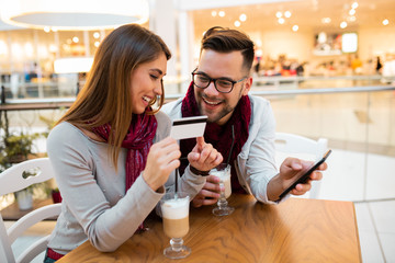 A couple about to test their new bank card.