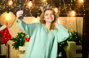 Selfie time. Greetings to family. Things to do before christmas. Woman christmas decorations background. Relax and recharge. Christmas is by far most awaited for holiday of year. Girl taking photo © be free