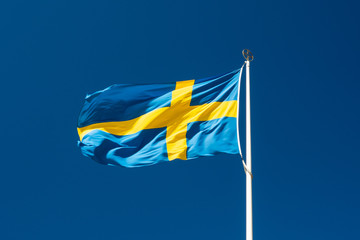 Swedish national flag on blue sky background