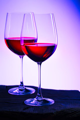 Two glasses of red wine. Intimate atmosphere. Romance concept