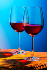 Two glasses of red wine. Intimate atmosphere. Romance concept