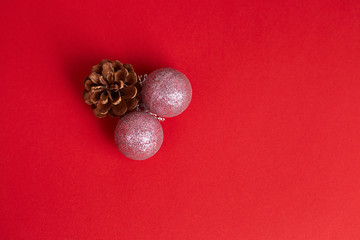 Christmas decorations on red background. Flat lay, top view, copy space