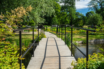 View over a small walking path in the botanical garden with blooming flowers, Uppsala, Sweden