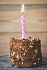 Sponge cake with a burning candle