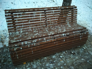 a bench stained with pigeon droppings