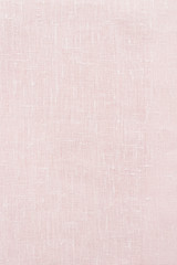Fototapeta na wymiar Pink linen pastel fabric, background or texture, closeup, top view