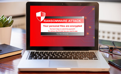 Ransomware attack concept. Ransomware text on a laptop screen