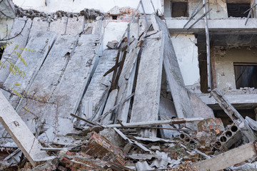 House destroyed after a gas explosion, a bomb, an earthquake without windows and a roof