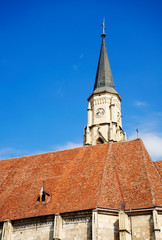 Obraz premium The Church of Saint Michael is a Gothic-style Roman Catholic cathedral in Cluj, second largest church in Transylvania, Romania, completed in 1442-1447.Statue of King Mathias (Matyas, Matei, Corvinus)