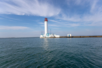 Fototapeta premium Lighthouse at sea. Light for sailors