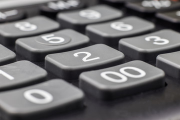 Numbers on calculator buttons close up