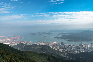 Panorama view of Shenzhen cityscape from top of Wutong Mountain on a sunny day
