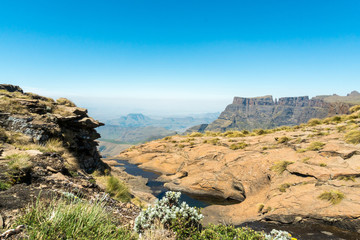 Fototapeta na wymiar Landscape of river and amphitheatre behind on the plateau of drakensberg mountains in South Africa