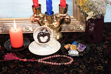 Close-up. Fortunetelling on coffee. On the saucer is an inverted cup with the rest of the coffee....