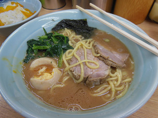 Ramen in a bowl, Japanese soup with noodles, meat, eggs and seaweed