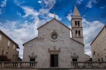 Fototapeta na wymiar Supetar, Croatia / June 27th 2018: Church of Saint Peter, sveti Petar in old town Supetar, Brac Island. Croatia, Europe