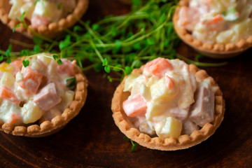 Russian olivier salade served for banquet table with cold snacks