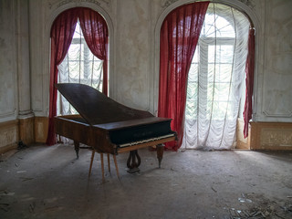 old piano in old mansion.