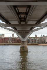 View of the city of London with the river Thames and the Millennium Bridge in the foreground