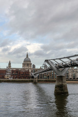 Naklejka premium View of the city of London with the river Thames and the Millennium Bridge in the foreground