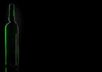 Wine green bottle silhouette. Closeup of an opening of a wine bottle with cork in front of black...