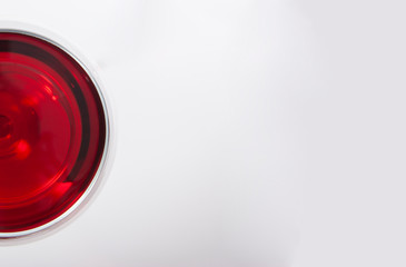 Glass of red wine with shadow with text field..Top view