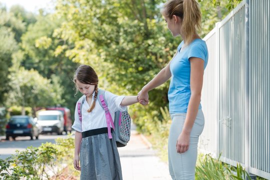 Unhappy Girl With Mom