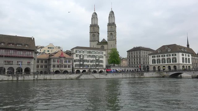 Limmatquai street with the Grossmunster church from the bank of Limmat river. Zurich, Switzerland.
