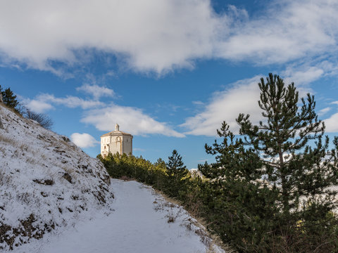Snowy path leading to the mountain church of Santa Maria della Pietà in Calascio