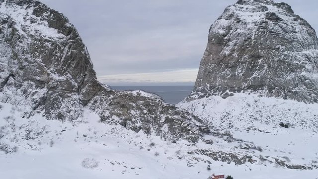 Mountains of Sanna island in winter, Nordland, Northern Norway, aerial drone shot