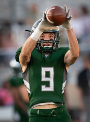 Action photos of football players making amazing plays during a football game