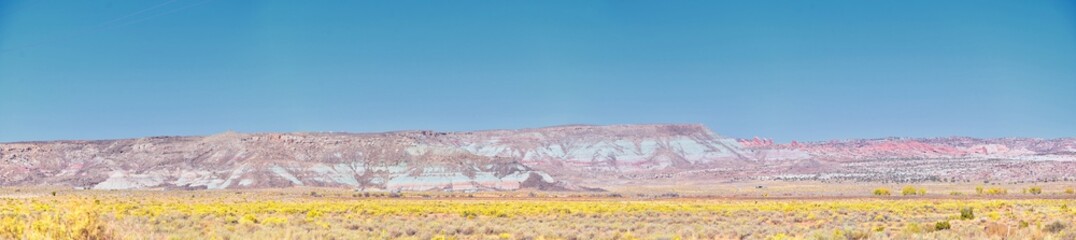 Looking back towards Moab Panorama views of desert mountain ranges along Highway 191 in Utah in fall. Scenic nature near Canyonlands and Arches  National Park. United States of America. USA.