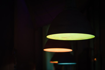 Group of colored round lamps in the dark