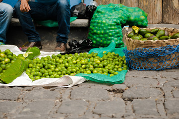 Fresh limes for sale at the street market in a small town in Guatemala.